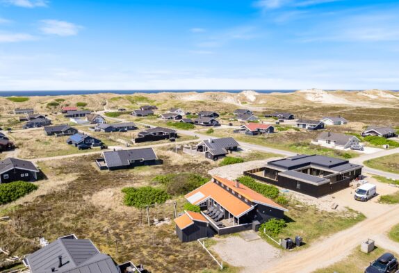 Ferienhaus mit geschlossener Terrasse nah am Strand