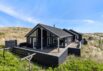 Lækkert sommerhus med aktivitetsrum, sauna og udendørs bruser (billede 1)
